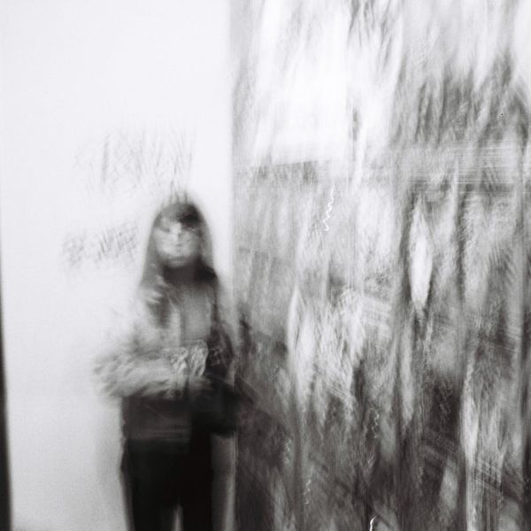 Abstract motion blur of a person exercising indoors