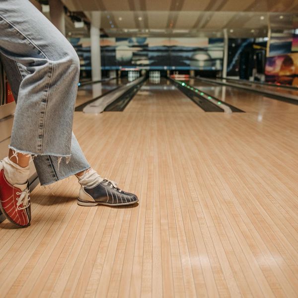 Close up of sports shoes on a wooden floor
